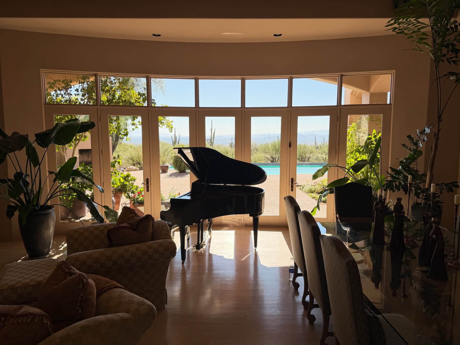 Clean French doors opening to a pool with a valley view